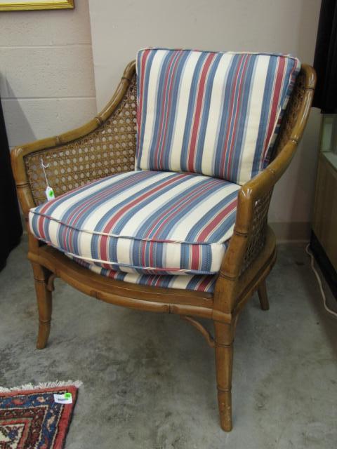 Appraisal: Arm chair with rattan-style frame with cane sides and back