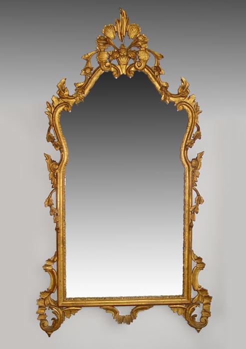 Appraisal: ROCOCO STYLE GOLD GILT WOOD MIRROR Floral filled basket bonnet