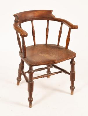 Appraisal: A Victorian elbow chair with dished elm seat Provenance Spetchley