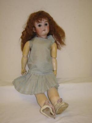 Appraisal: A Max Handwerck bisque head girl doll with brown glass