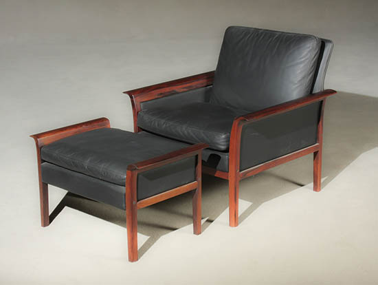 Appraisal: Hans Olsen Black Leather and Rosewood Lounge Chair and Ottoman