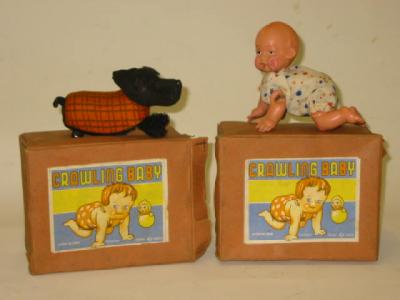 Appraisal: Three Crawling Baby toys celluloid construction clockwork powered two with