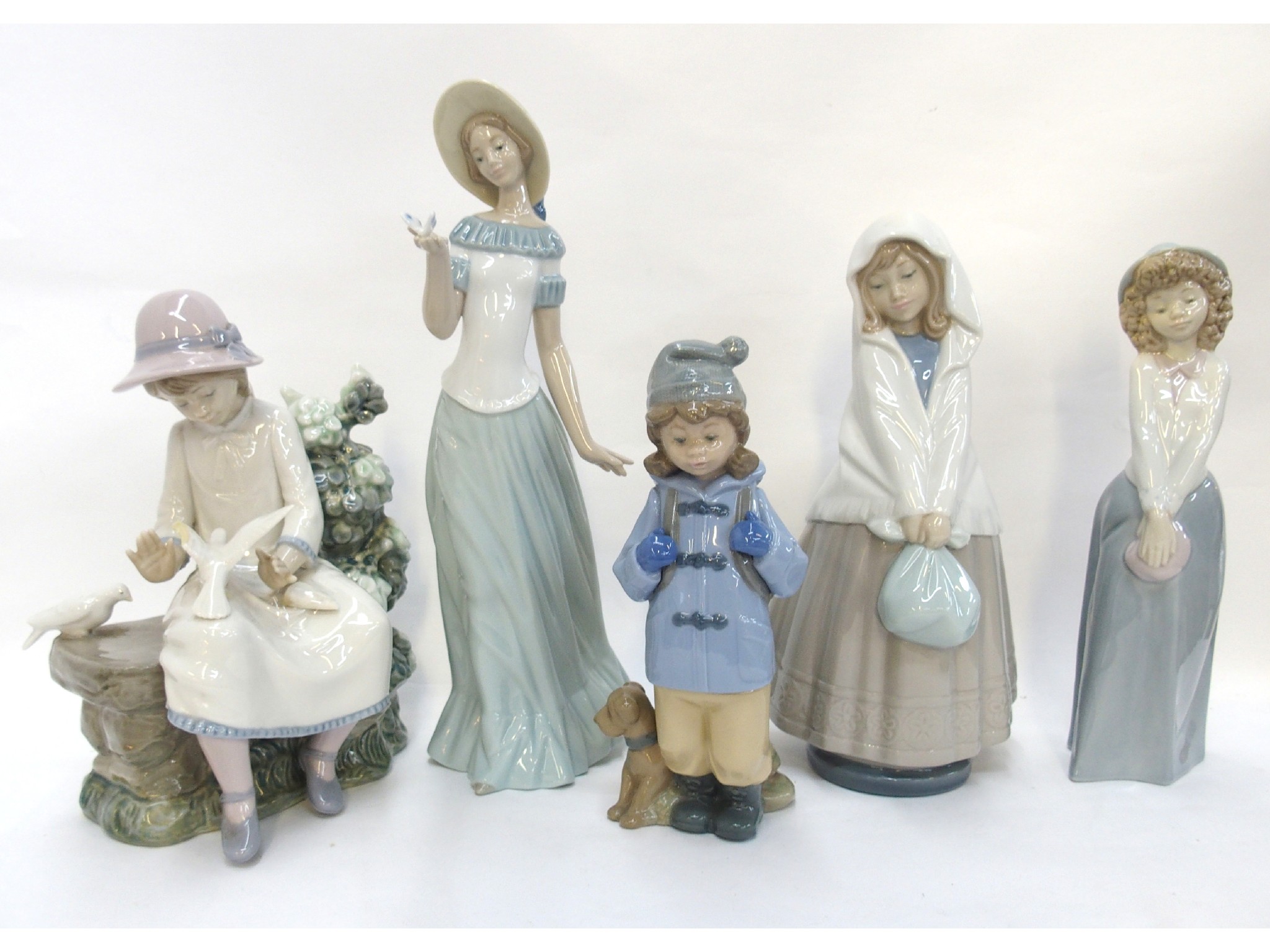 Appraisal: Five Nao figures including a girl with butterfly girl with