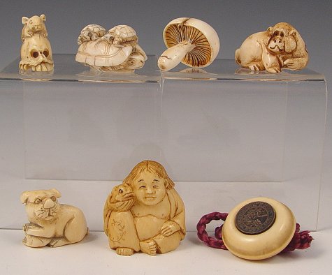 Appraisal: COLLECTION JAPANESE CARVED IVORY NETSUKE Man with toads signed in