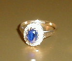 Appraisal: A white and blue stone set cluster dress ring set