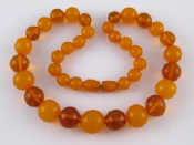 Appraisal: A graduated amber bead necklace largest bead approx mm diameter