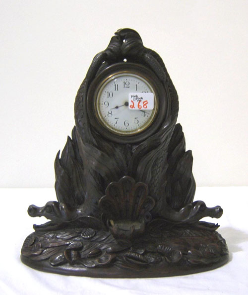 Appraisal: New Haven carved mahogany shelf clock with serpents flanking a