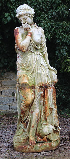 Appraisal: A CREAM PAINTED CAST IRON STATUE of a semi clad