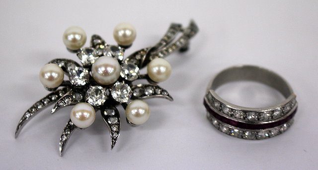 Appraisal: A CULTURED PEARL ZIRCON SET BROACH together with a paste