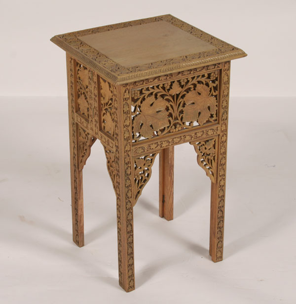 Appraisal: Ornately carved wooden stand table floral motif on all surfaces