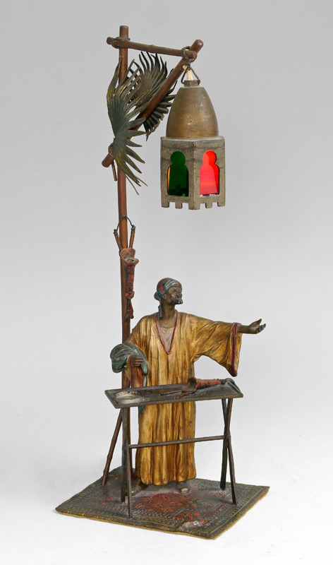 Appraisal: AUSTRIAN ORIENTALIST MERCHANT BRONZE LAMP Figure of a orientalist merchant