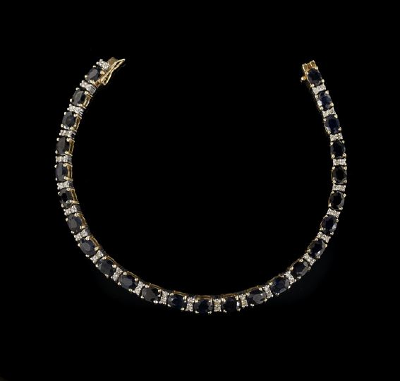 Appraisal: Fourteen-Karat Yellow Gold Sapphire and Diamond Straight-Line Lady's Bracelet composed