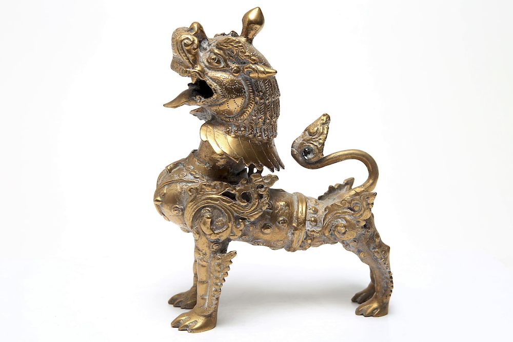 Appraisal: Tibetan Asian Gilt Metal Foo Lion Sculpture Asian possibly Tibetan