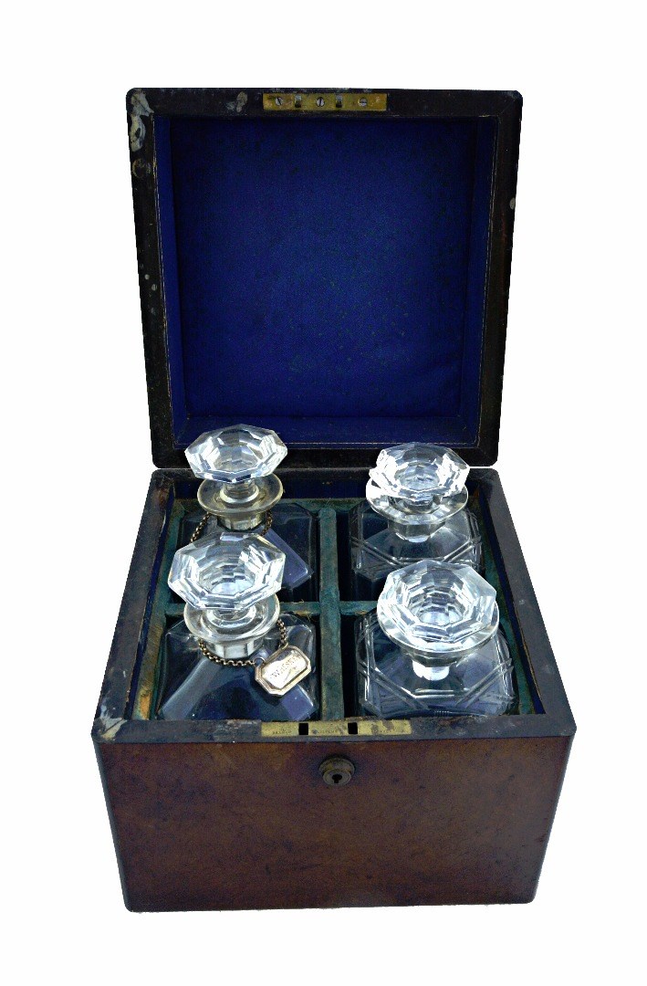 Appraisal: A Victorian figured walnut decanter box the square lift top