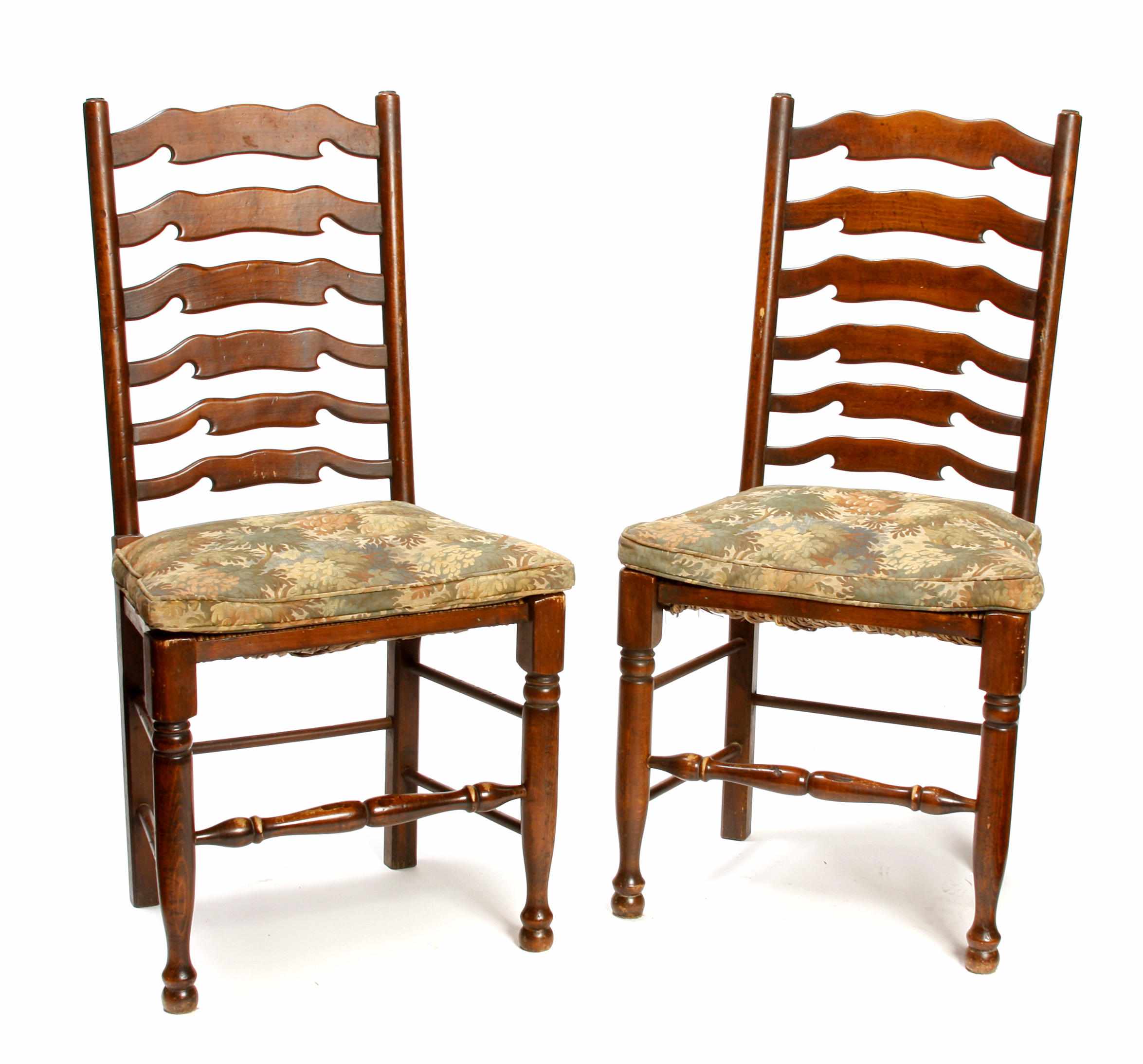 Appraisal: A set of eight George III style mixed wood ladderback