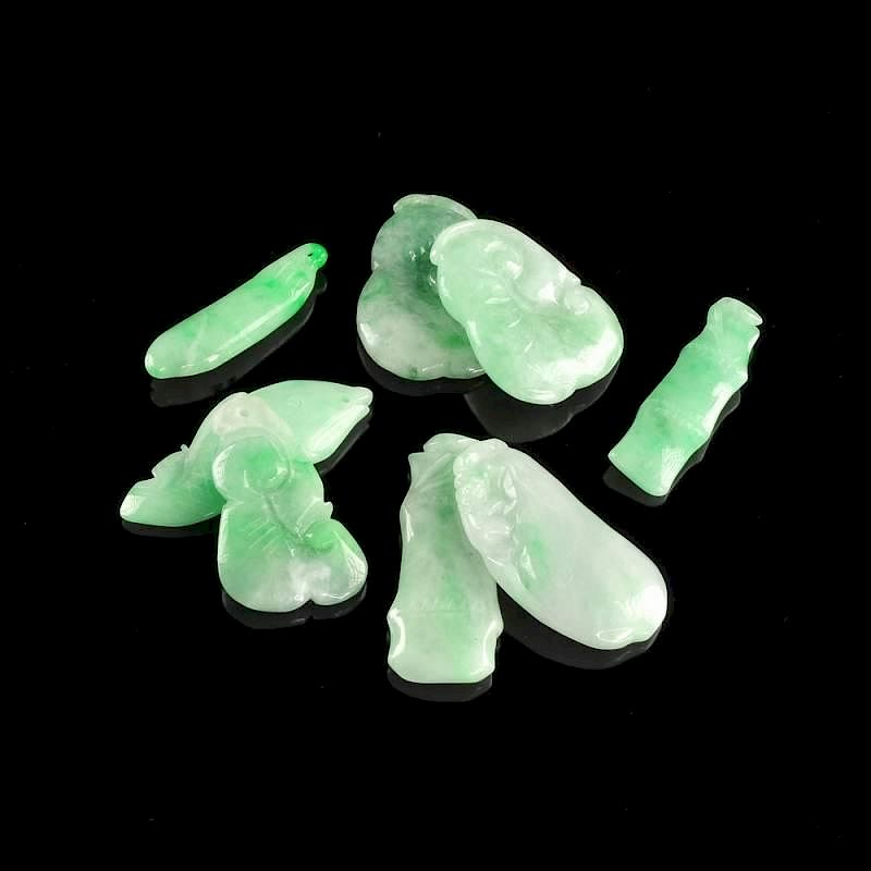 Appraisal: A GROUP OF EIGHT CHINESE CARVED APPLE GREEN FLECKED JADEITE