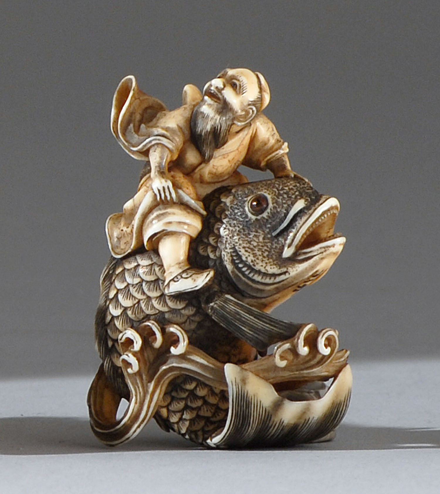 Appraisal: IVORY NETSUKE th CenturyBy Mitsuhiro Depicting a sennin riding on