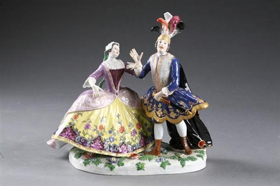 Appraisal: PORCELAIN FIGURAL GROUP Germany th century porcelain Man wearing fanciful