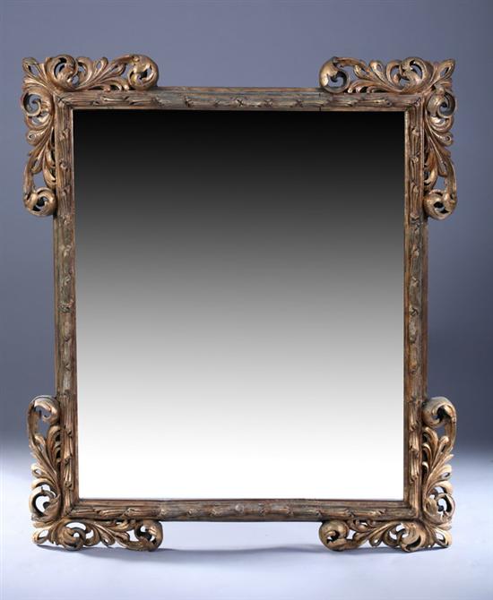 Appraisal: CONTINENTAL ROCOCO STYLE GILT-WOOD WALL MIRROR th century Rectangular frame