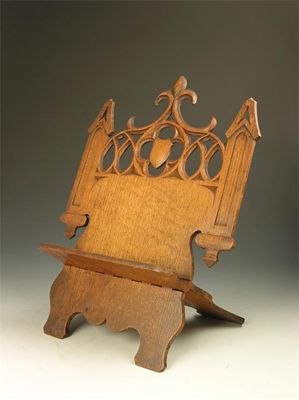 Appraisal: A Victorian carved oak folding book stand with pierced decoration