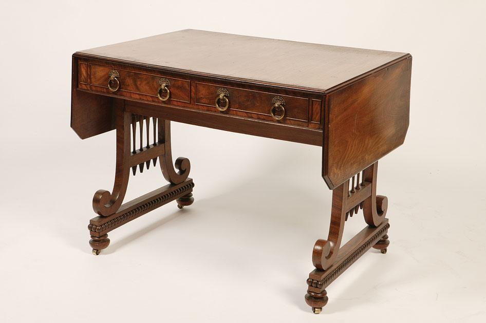 Appraisal: A REGENCY MAHOGANY SOFA TABLE in the manner of William