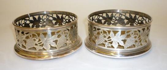 Appraisal: A PAIR OF PLATED ON COPPER BOTTLE COASTERS mid th