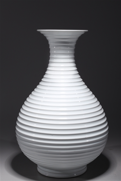 Appraisal: Chinese white glazed porcelain vase with ribbed design to body