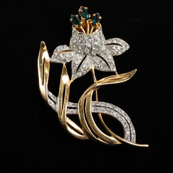 Appraisal: Reinad pave gold tone flower brooch with emerald crystal jewels