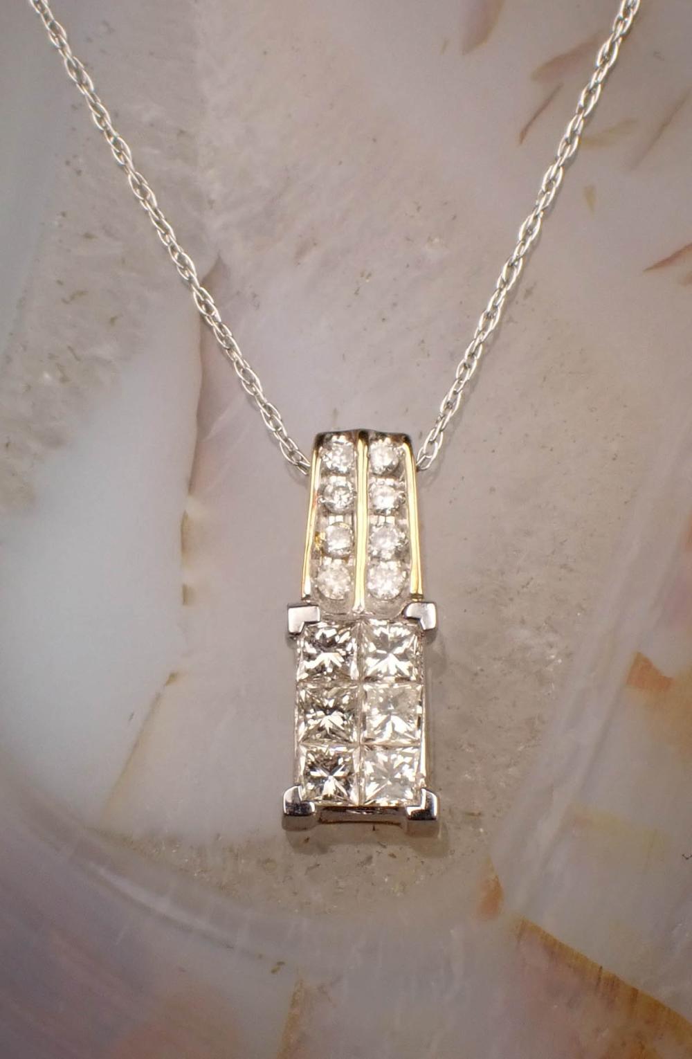 Appraisal: DIAMOND AND FOURTEEN KARAT GOLD PENDANT NECKLACE with an dainty