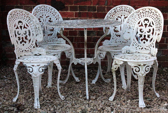 Appraisal: A WHITE PAINTED CAST ALUMINIUM CIRCULAR GARDEN TABLE with pierced