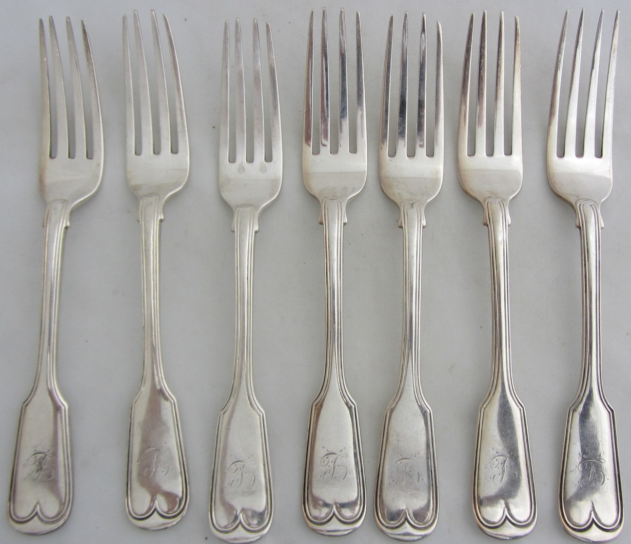 Appraisal: Seven silver double struck fiddle and thread pattern table forks