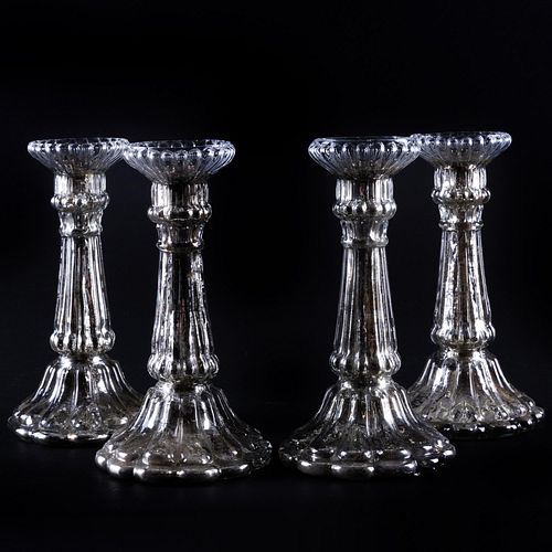 Appraisal: SET OF FOUR MERCURY GLASS CANDLESTICKSUnmarked x in diam Condition