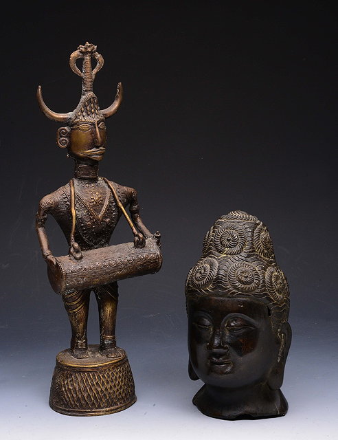 Appraisal: A BRONZE HEAD OF BHUDDA cm high and a cast