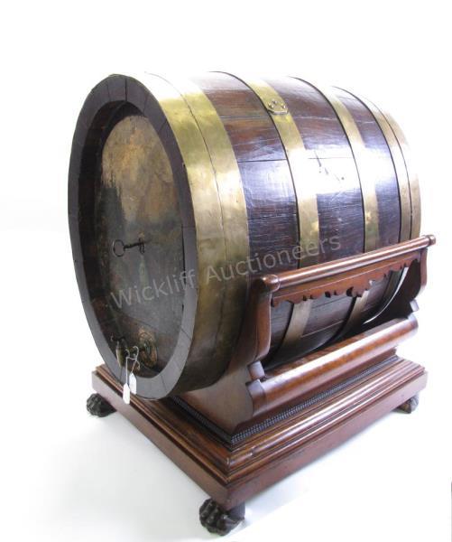 Appraisal: Antique wine barrel safe consisting of brass banded hand hammered