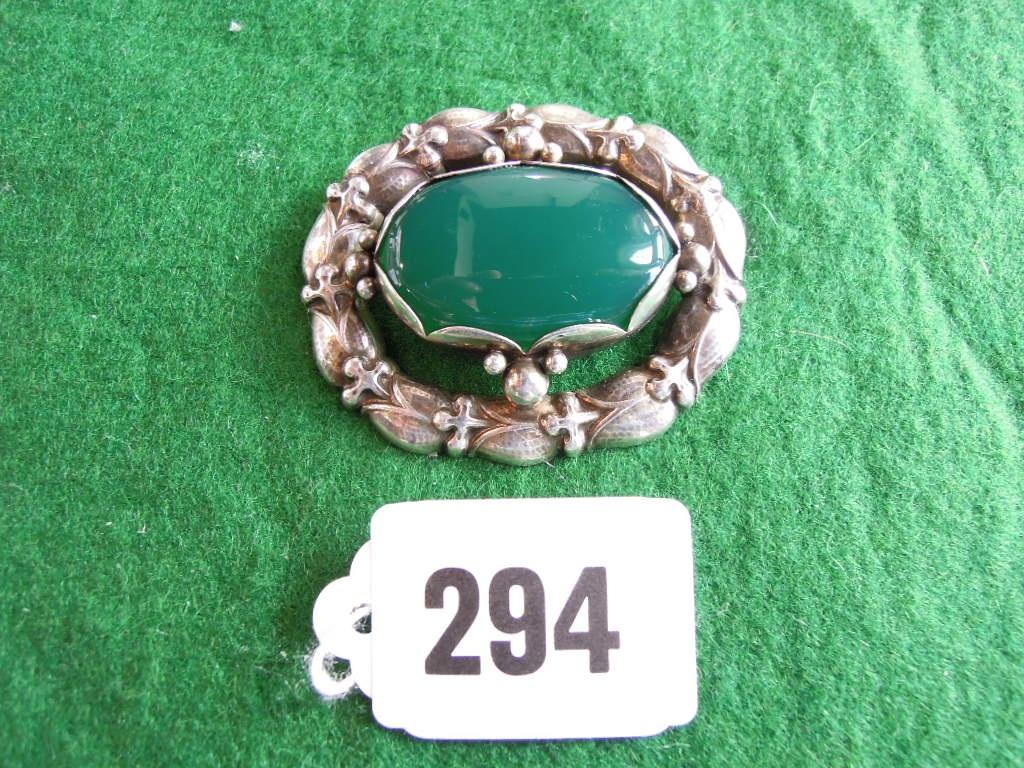 Appraisal: A green hardstone and silver brooch by Georg Jensen the