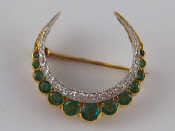 Appraisal: A fine antique carat gold emerald and diamond crescent brooch