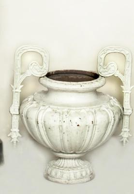 Appraisal: A PAIR OF VICTORIAN CAST IRON GARDEN URNS th century