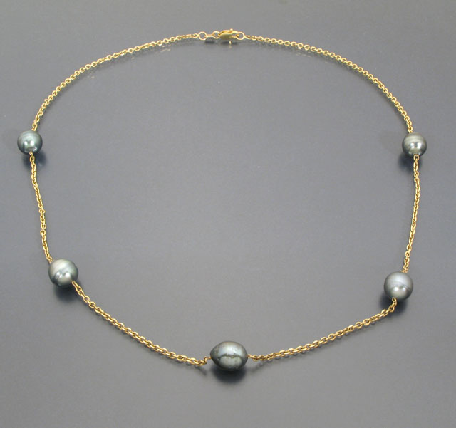 Appraisal: PEARL AND FOURTEEN KARAT GOLD CHAIN NECKLACE the chain highlighted