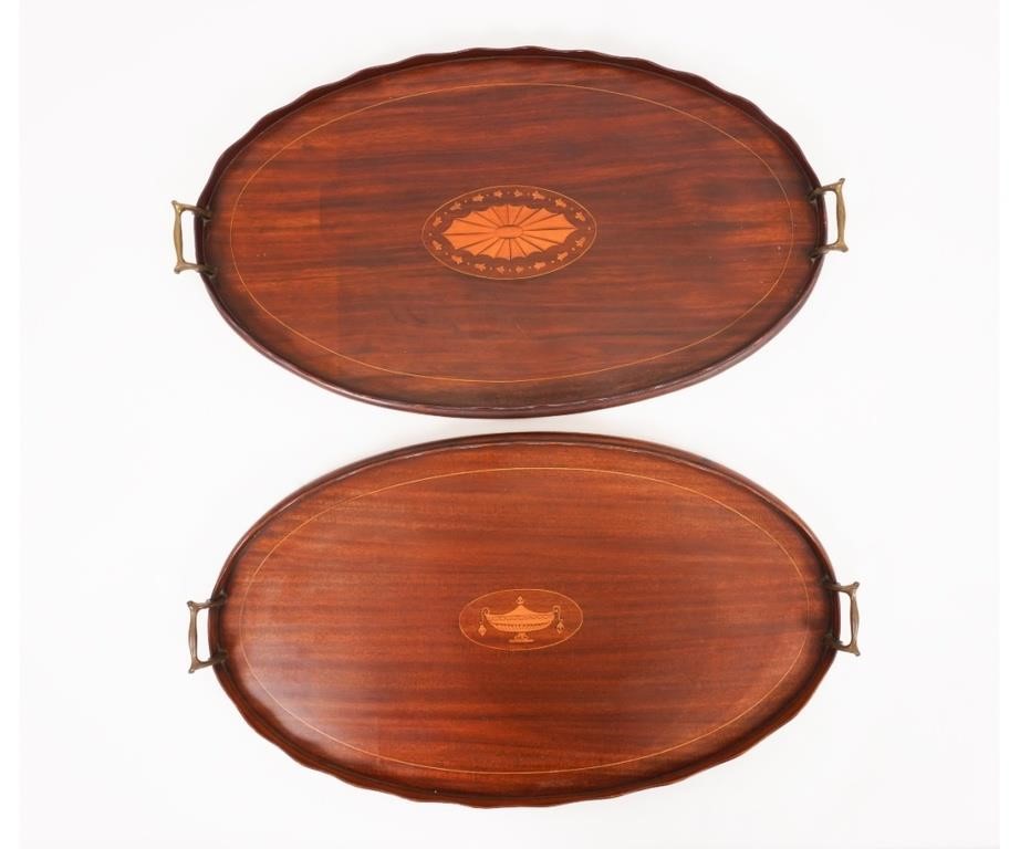 Appraisal: Two similiar Chippendale style mahogany inlaid serving trays with brass