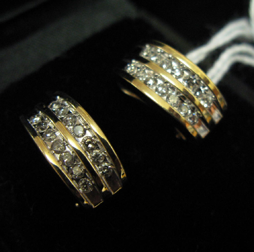 Appraisal: A PAIR OF DIAMOND AND FOURTEEN KARAT YELLOW AND WHITE