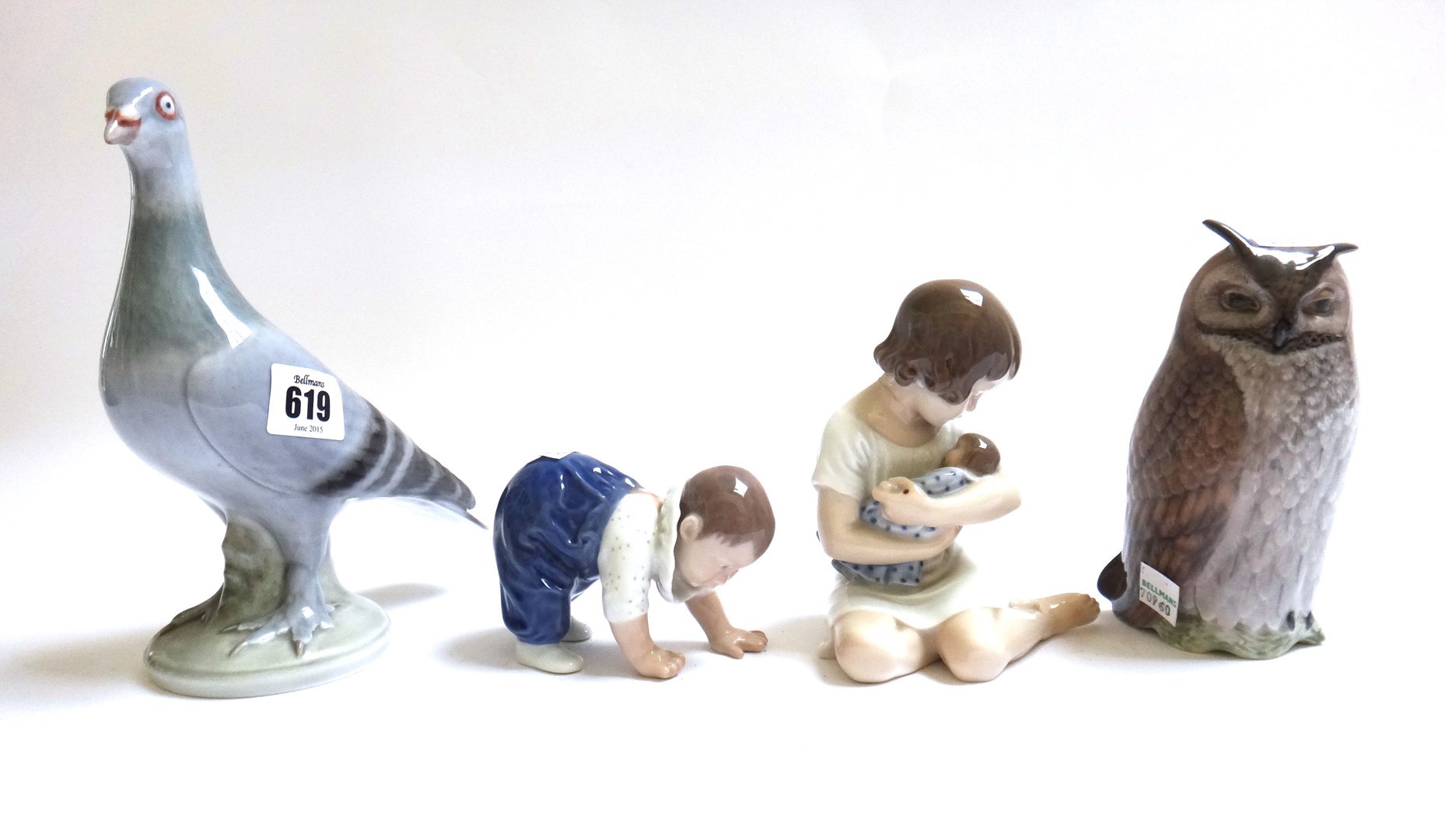 Appraisal: Three Royal Copenhagen porcelain figures including a young girl holding