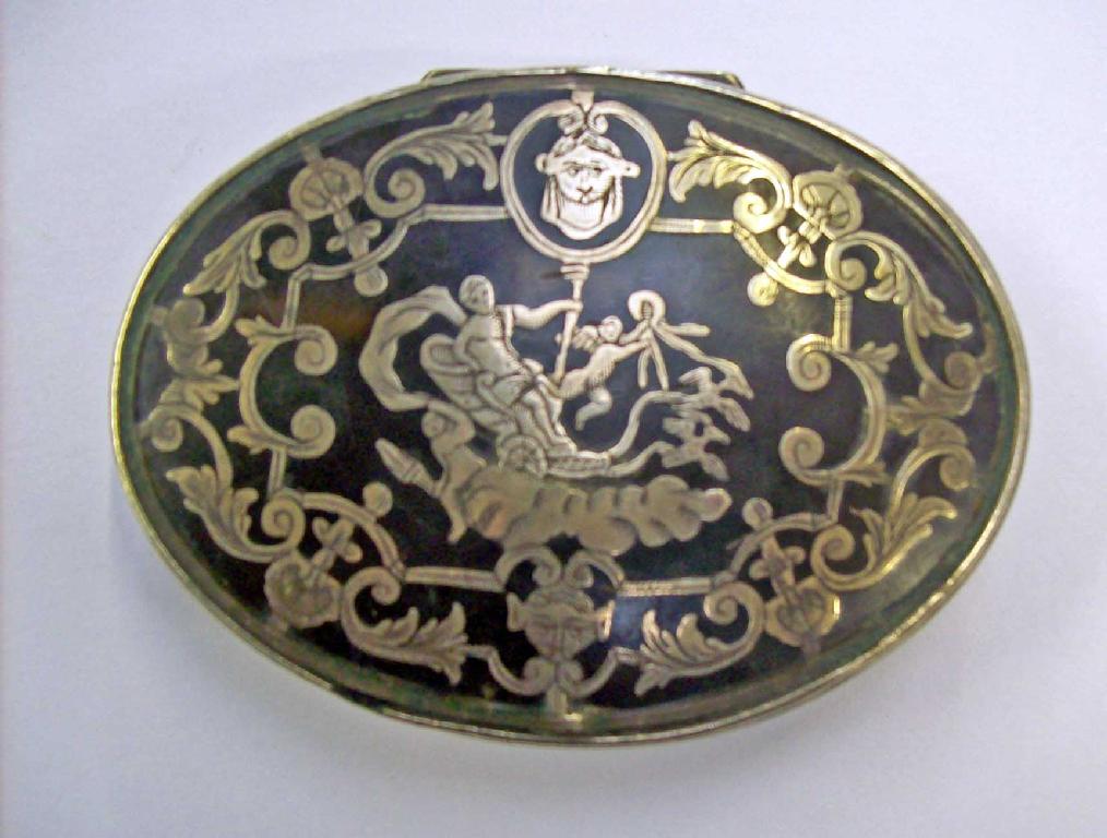 Appraisal: A silver and tortoiseshell box decorated with a filigree scene