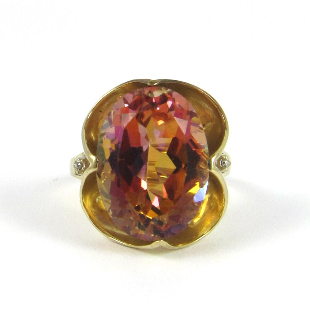 Appraisal: MYSTIC TOPAZ DIAMOND AND YELLOW GOLD RING The k gold