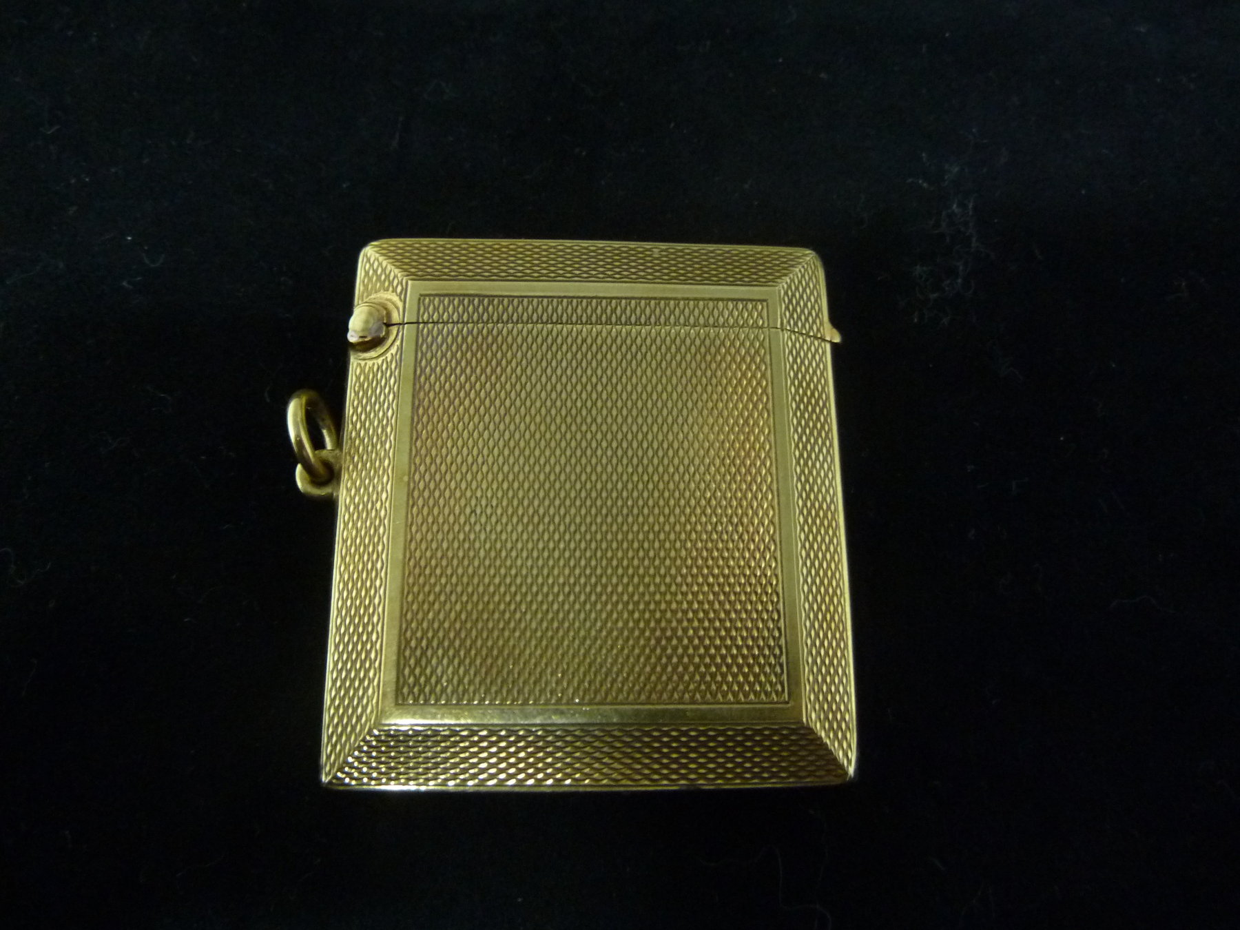 Appraisal: An ct gold vesta case by Asprey with engine-turned decoration