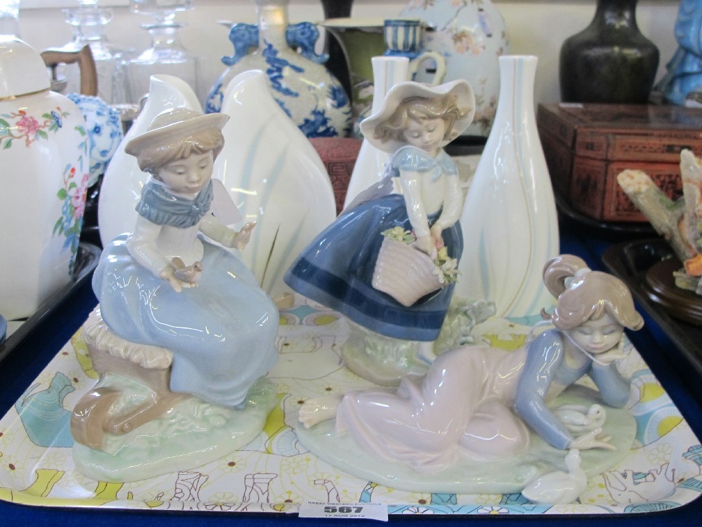 Appraisal: Two Lladro figures and a Nao figure of girls and