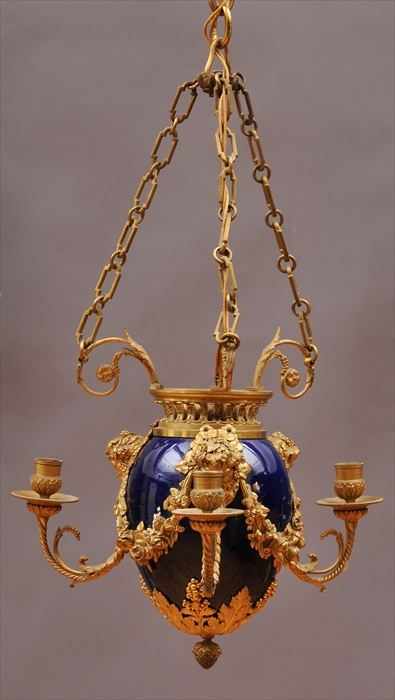 Appraisal: LOUIS XVI-STYLE GILT-METAL MOUNTED PORCELAIN THREE-LIGHT CHANDELIER The ovoid cobalt-glazed