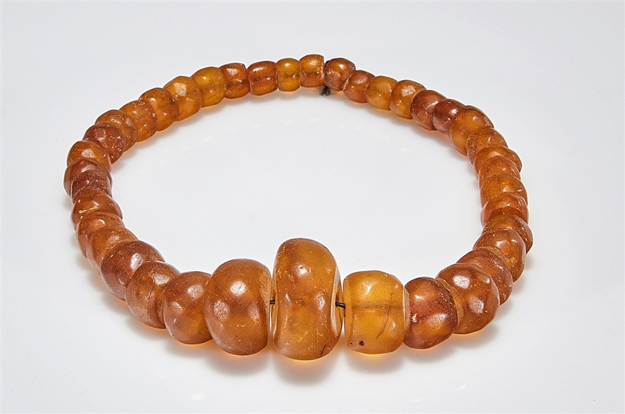 Appraisal: String of amber or copal beads graduated beads from approx