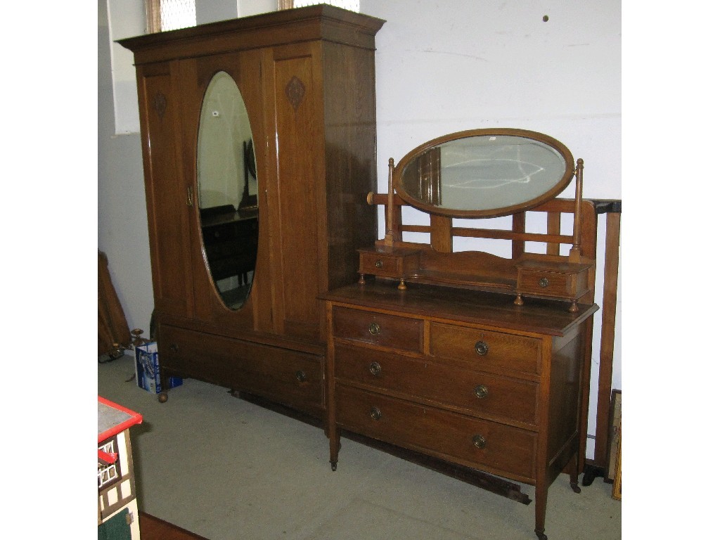 Appraisal: Edwardian oak mirror door wardrobe matching dressing table and a