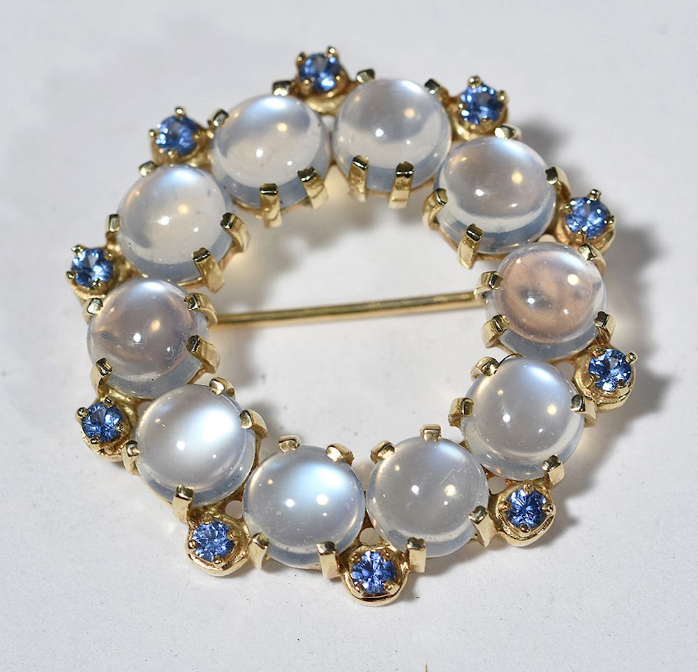 Appraisal: Tiffany Co K moonstone and sapphire circle pin Tiffany Co