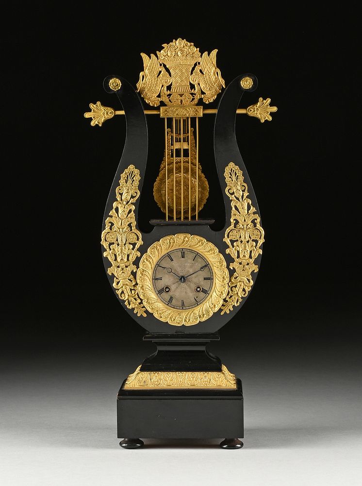 Appraisal: A CHARLES X ORMOLU MOUNTED EBONY LYRE FORM MANTLE CLOCK